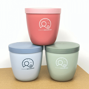 Stacked overnight oats pots in blue, green and pink