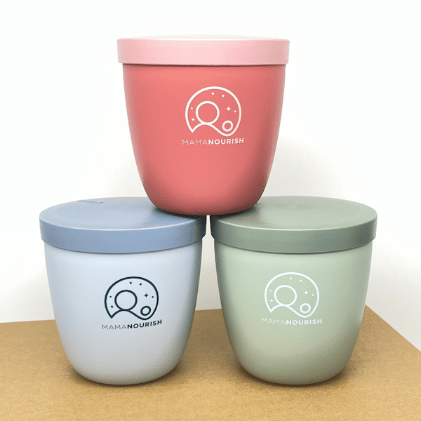 Stacked overnight oats pots in blue, green and pink